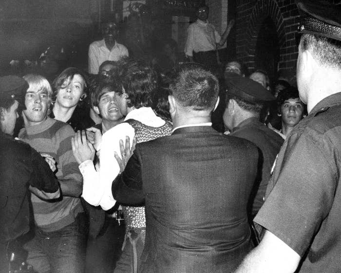 Queer Stonewall rioters keeping police officers at bay in 1969