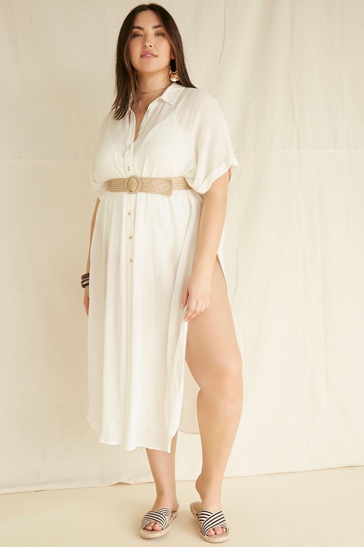 Plus-size model wearing the dress in cream with a rattan belt 