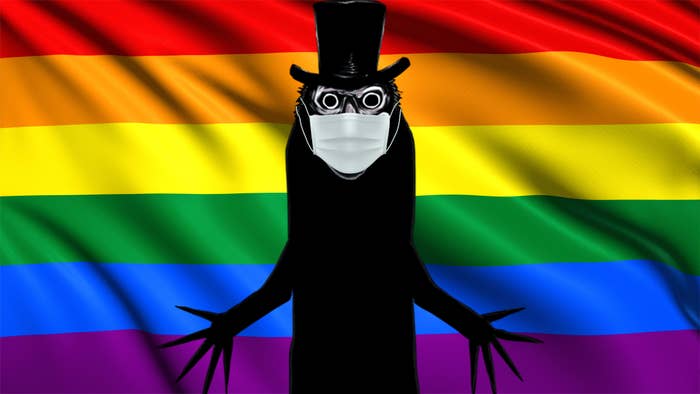 Gay icon, the Babadook, wearing a face mask while celebrating Pride Month in front of the pride flag