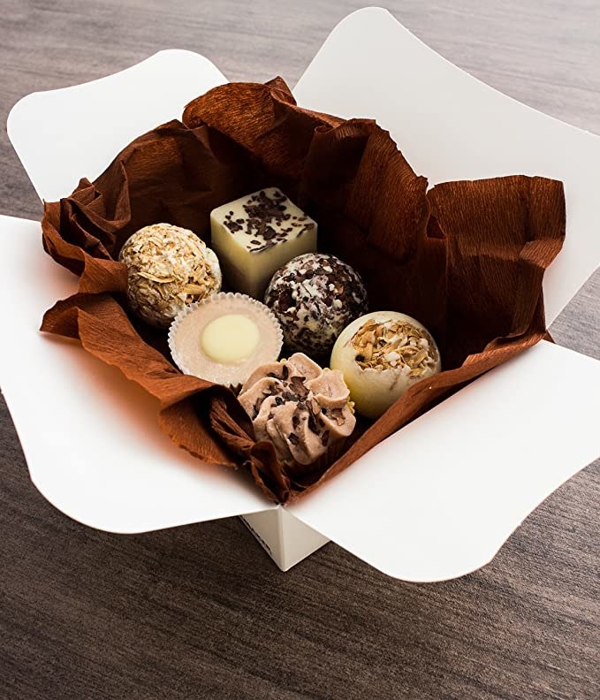 A box with six bath bombs that look like chocolate truffles