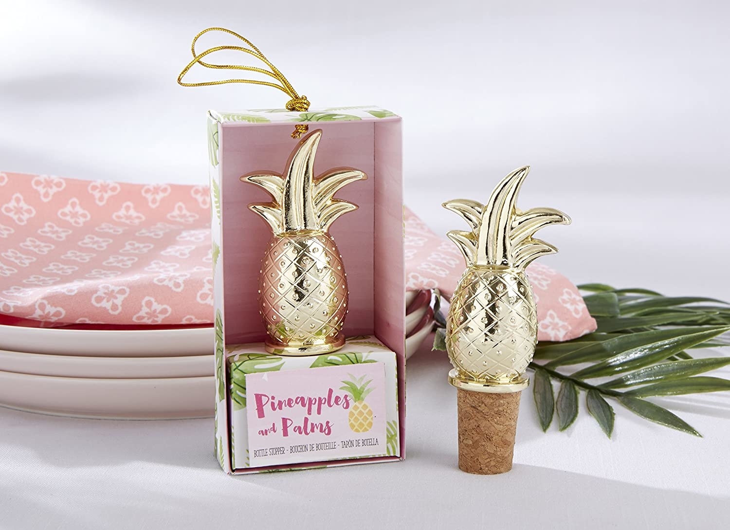 A pineapple wine stopper in a package and a pineapple wine stopper showing the cork