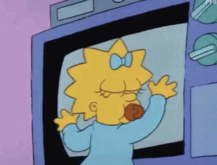 Maggie Simpson hugging a TV