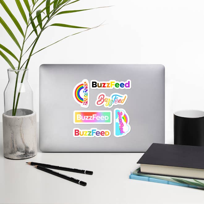 Six stickers that say BuzzFeed in a variety of designs and rainbow colors