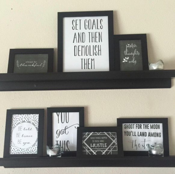 A customer review photo of the frames displayed on multiple shelves