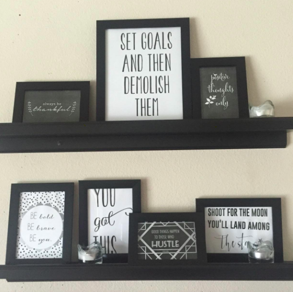 A customer review photo of the frames displayed on multiple shelves. 