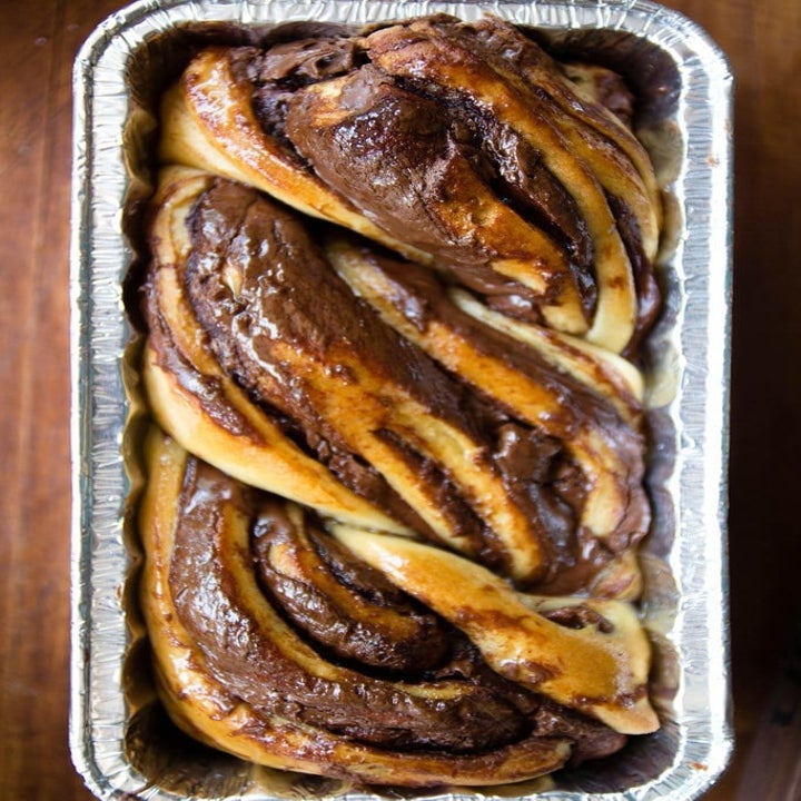 A Breads Bakery copycat braided chocolate babka in a loaf pan.