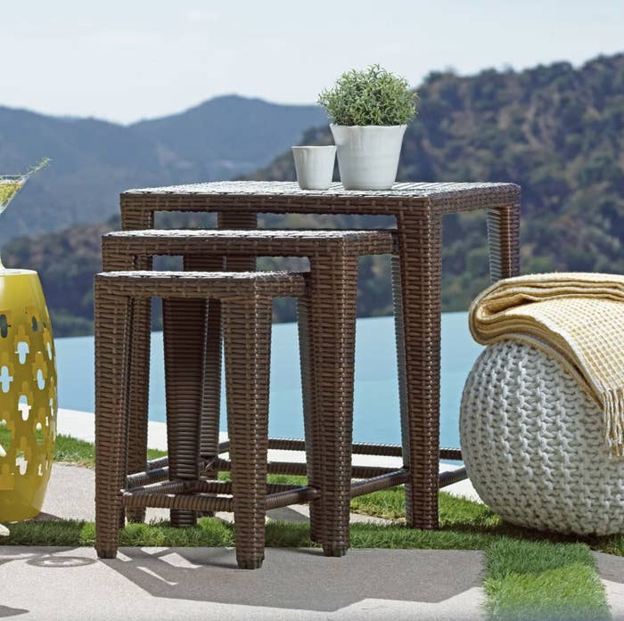 A set of three tables of differing heights