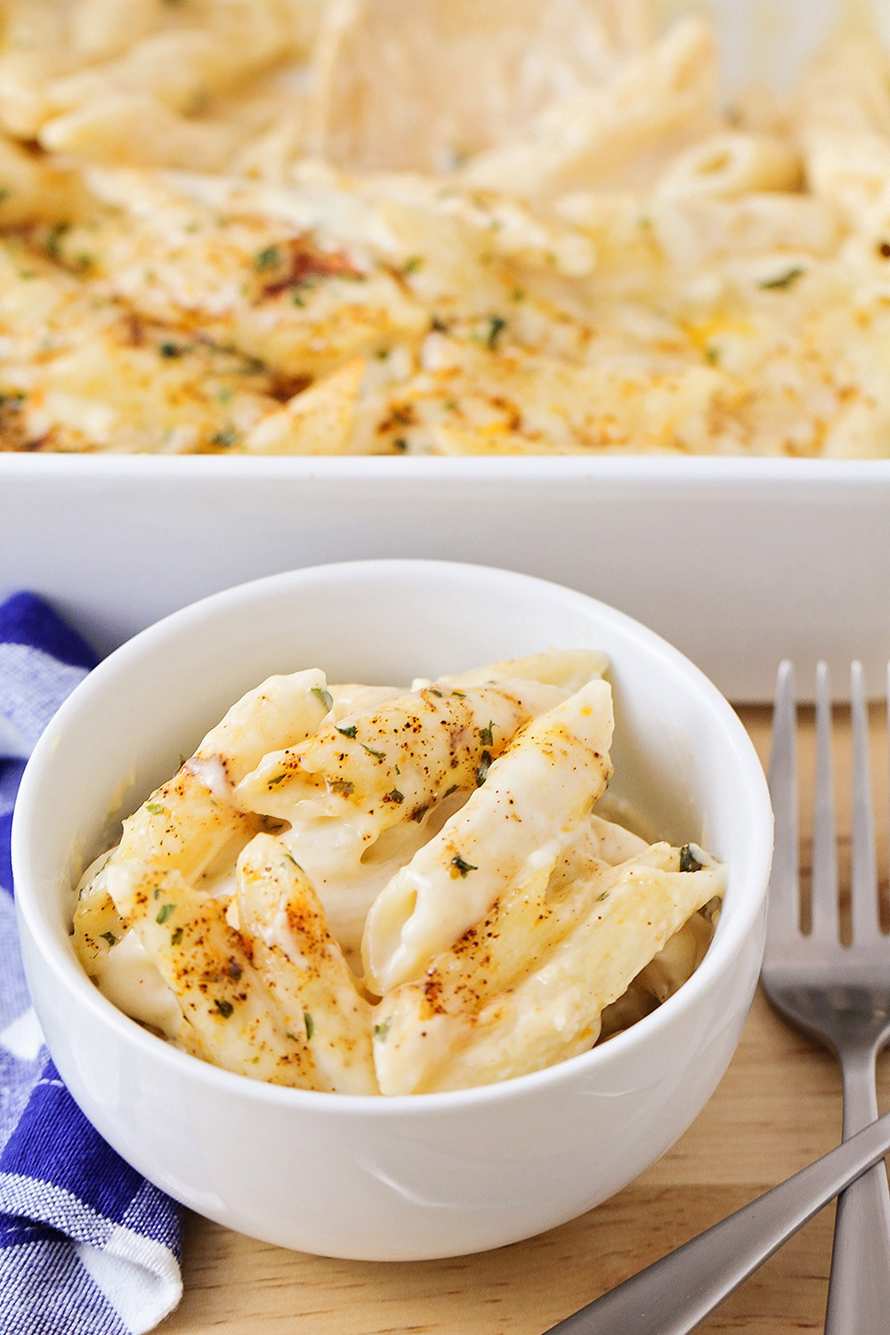 A bowl of super cheesy, creamy mac &#x27;n&#x27; cheese with penne noodles.