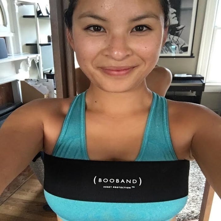 Nicole Nguyen wearing black elastic band on top of a blue sports bra