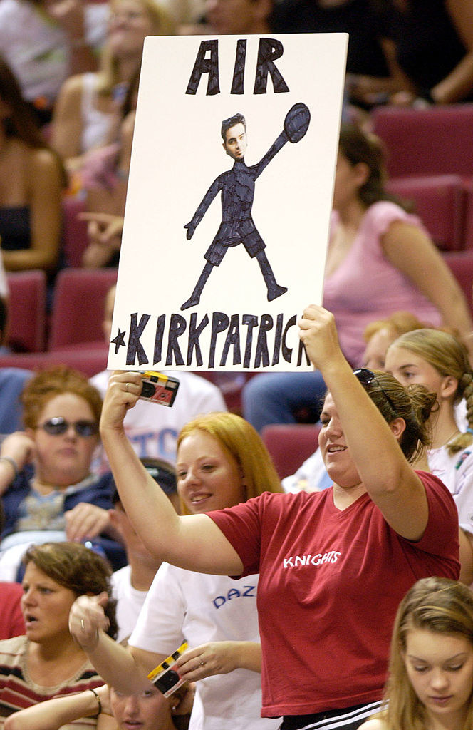 a chris kirkpatrick fan holding up a disposable camera