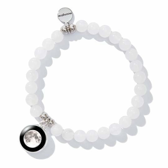 The bracelet, which has a moon photo charm and a small silver engraved charm