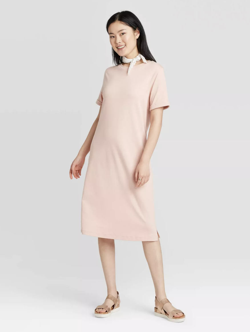 Model wearing the dress in light pink 
