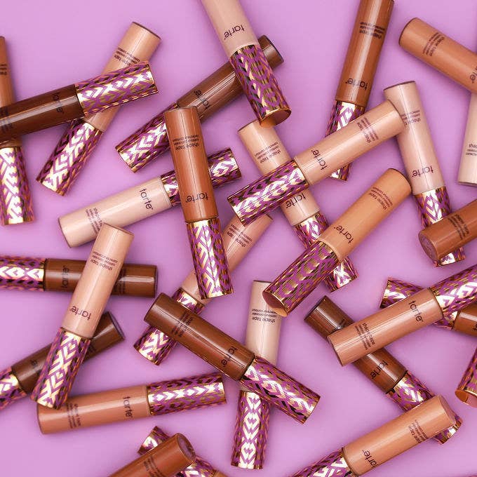A bunch of Tarte Shape Tape tubes in a variety of different shades