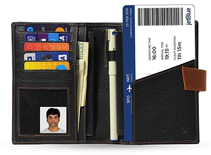 An open view of the wallet with cards, money and a boarding pass in it.