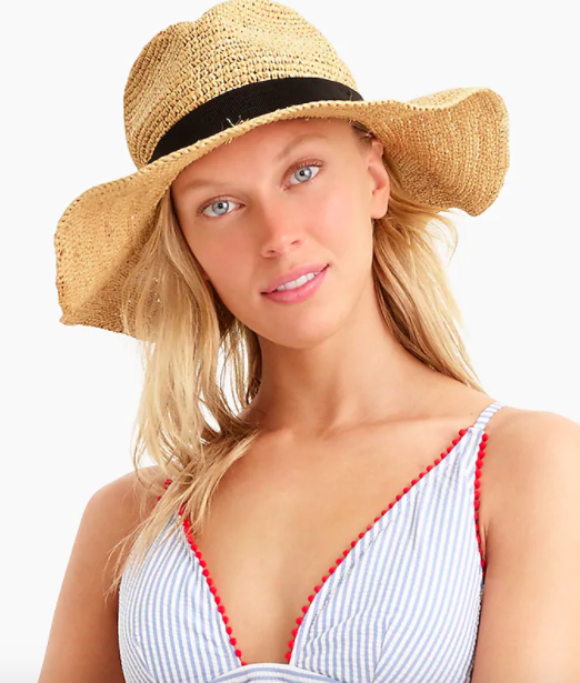 Model wearing the J.Crew wide-brim packable straw hat