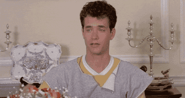 Gif of Tom Hanks in Bachelor Party sipping tea with his pinky in the air