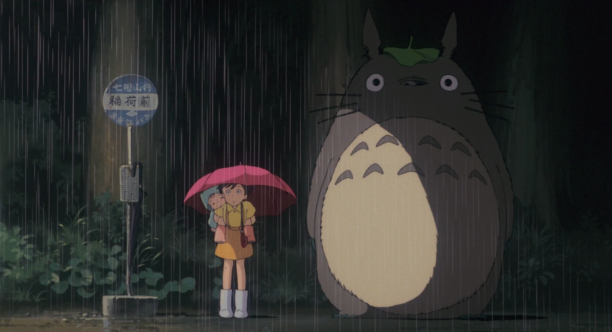 Screenshot of the sisters and Totoro at a bus stop 