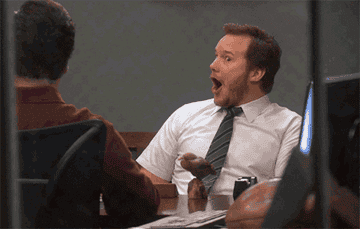 Gif of Andy from Parks and Rec looking pleasantly shocked 