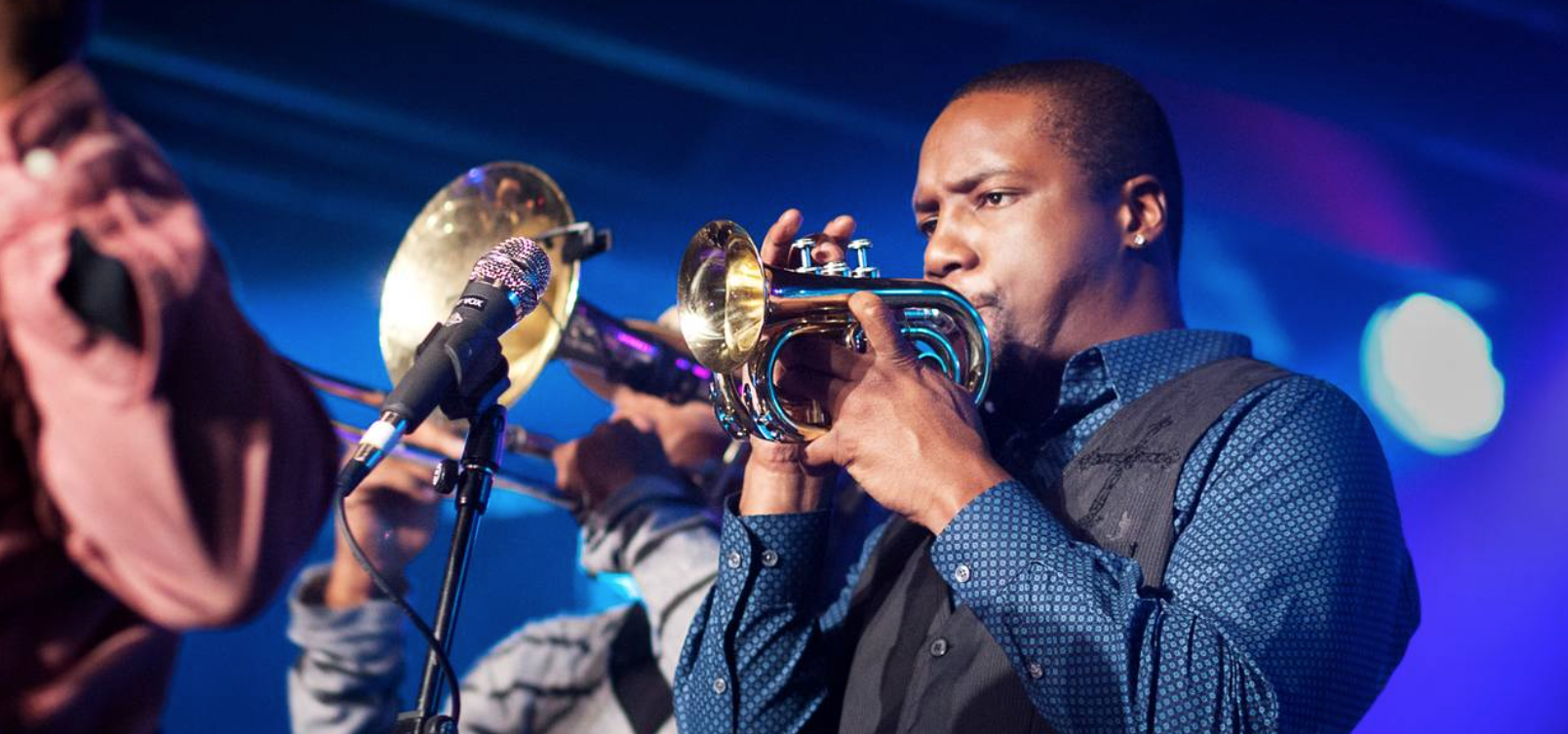 Screenshot of Delmond playing the trumpet