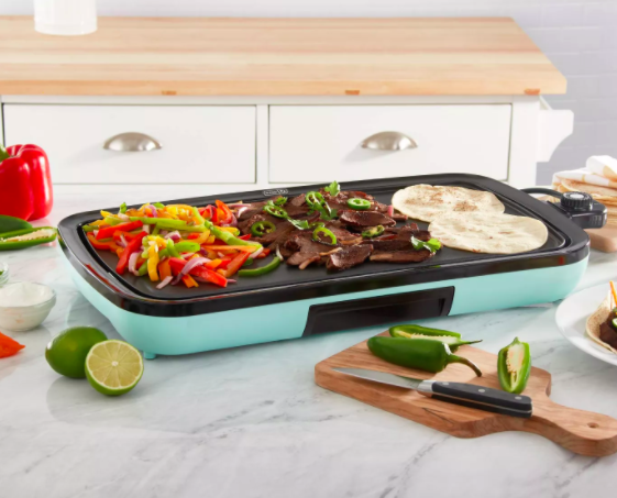 Blue Dash Everyday Electric Griddle cooking peppers, meat strips, and tortillas