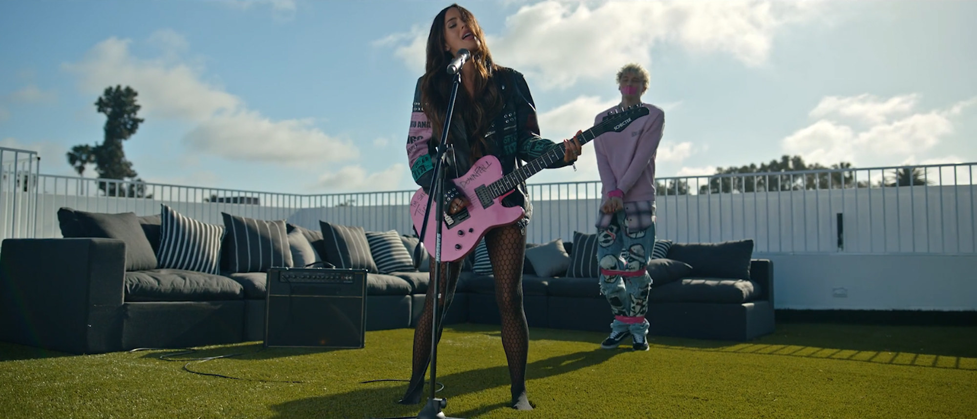 Megan Fox takes the microphone in Machine Gun Kelly&#x27;s &quot;Bloody Valentine&quot; video