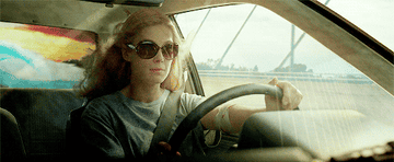 Amy from Gone Girl driving with the windows down 