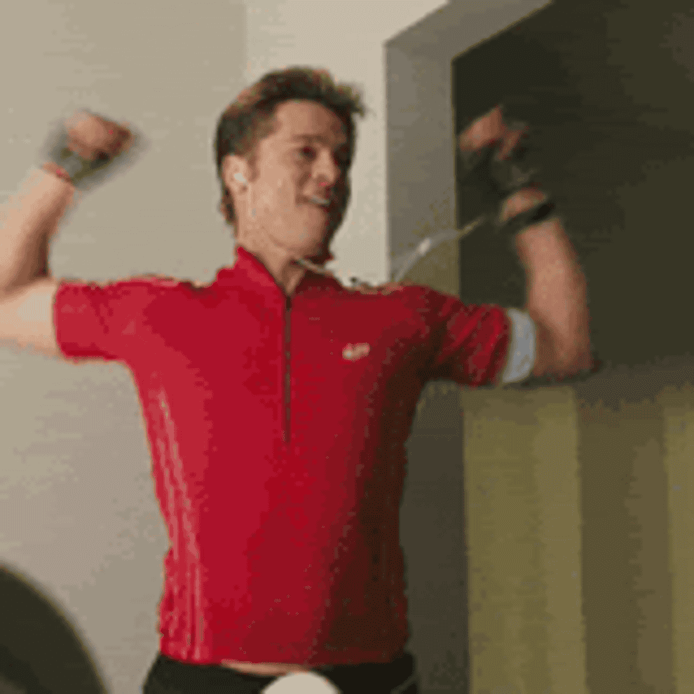 gif of brad pitt in the movie &quot;burn after reading&quot; dancing happily with headphones in