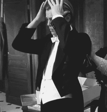 A gif of Leonardo DiCaprio adjusting his hair from the movie Titanic.