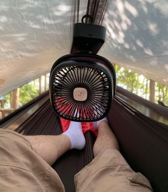 Reviewer&#x27;s photo of the fan hung in their tent