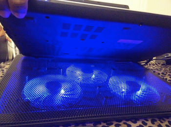 reviewer photo of the cooling pad emitting blue light 