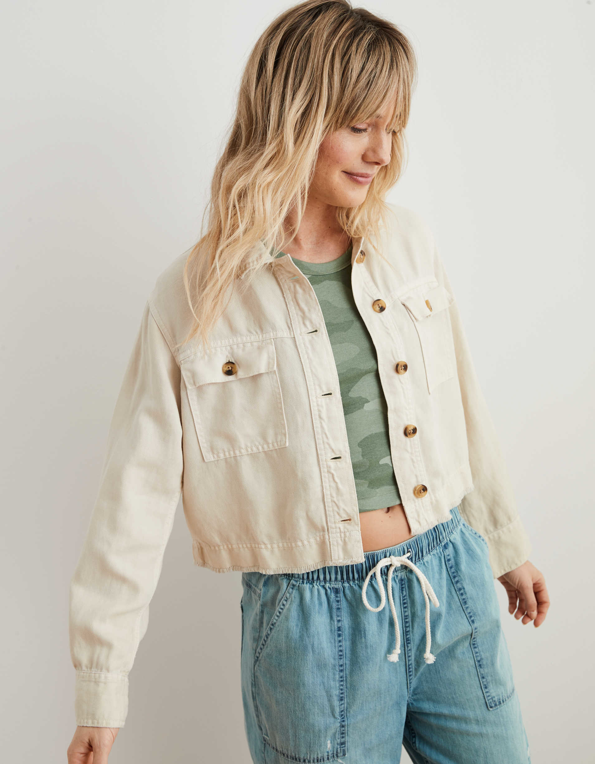 A model wears the empire cream Aerie twill cropped jacket