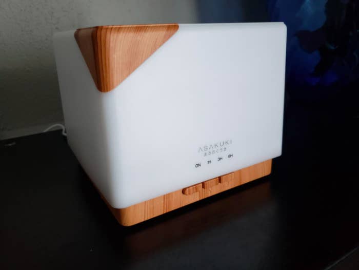 White diffuser with wood accents and square base 