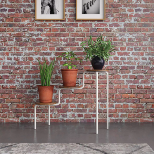 three tier plant stand with thin white legs and natural wood surfaces