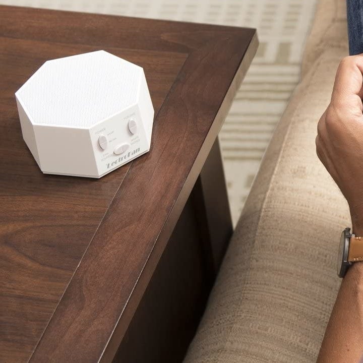 hand-sized white sound machine 