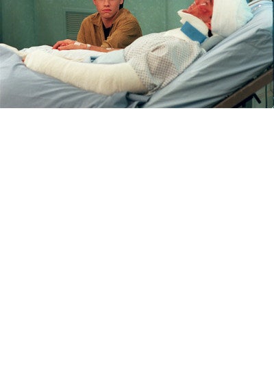Mr. Turner lying in a hospital bed 