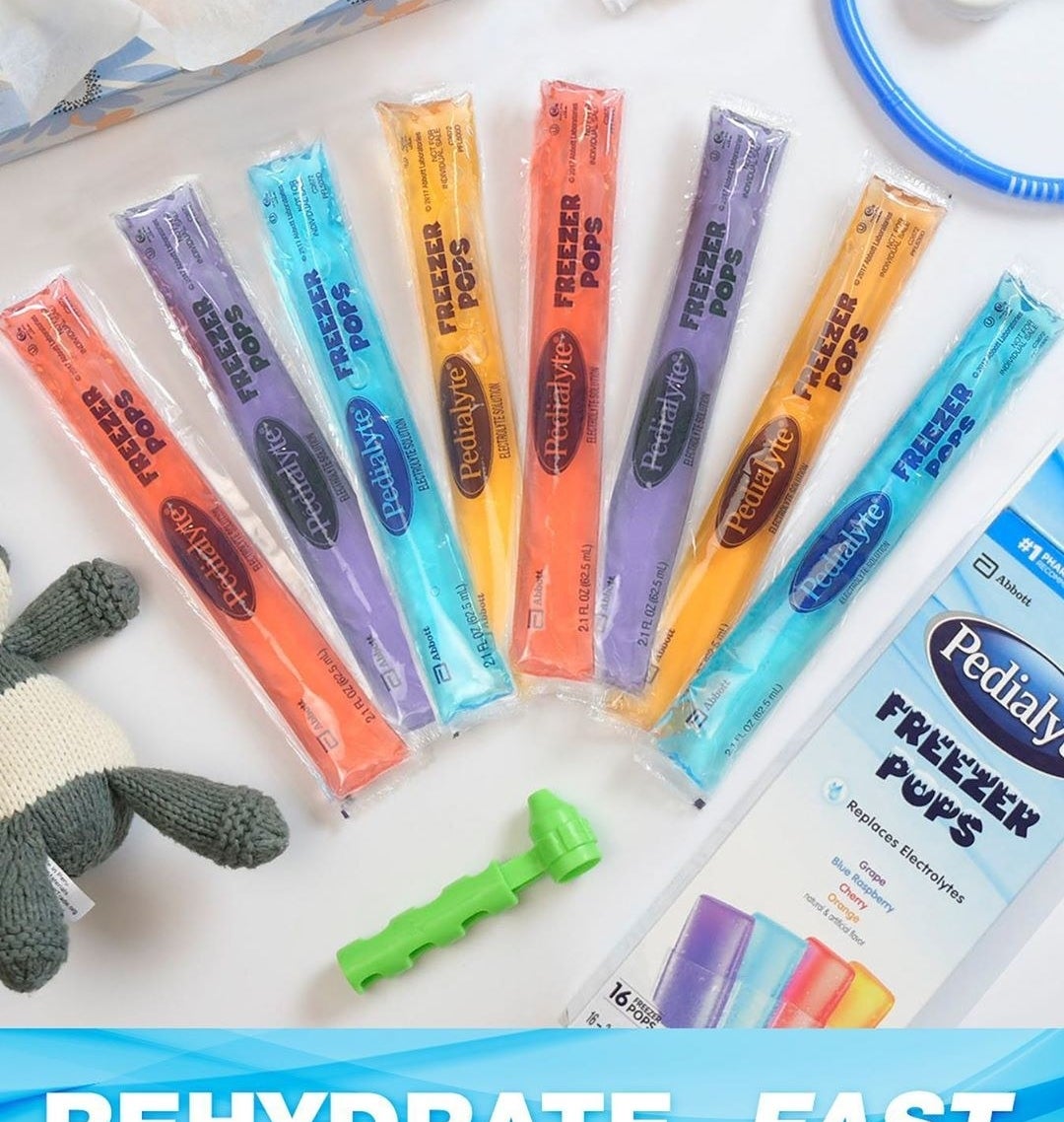 A variety of pops are fanned out on a counter