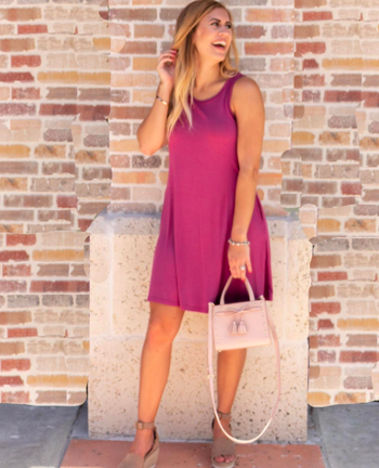 reviewer wearing the above-the-knee dress in mauve