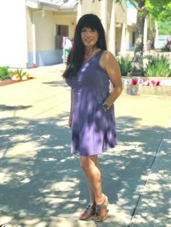 reviewer wearing the dress in purple-gray