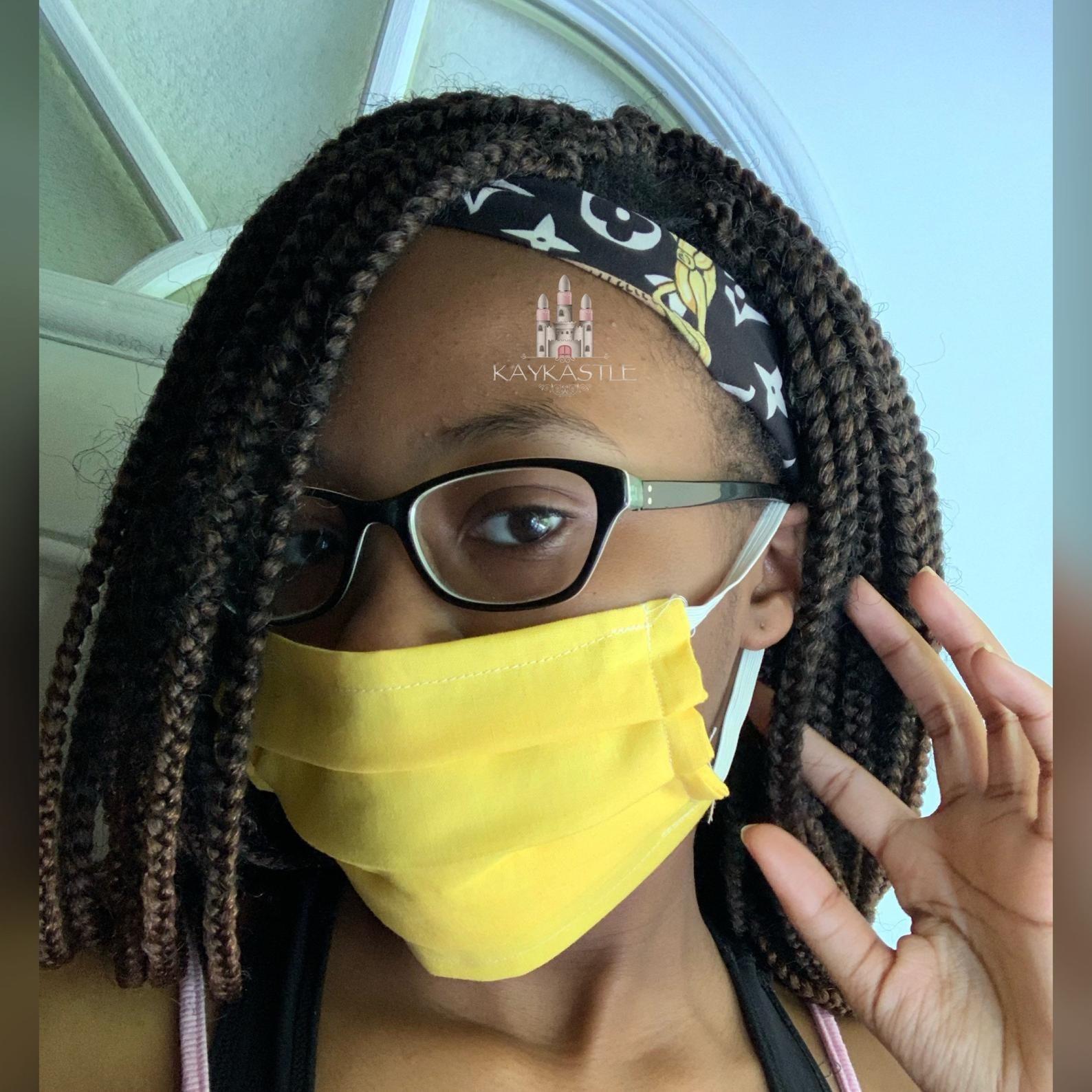 A model in a yellow face mask 