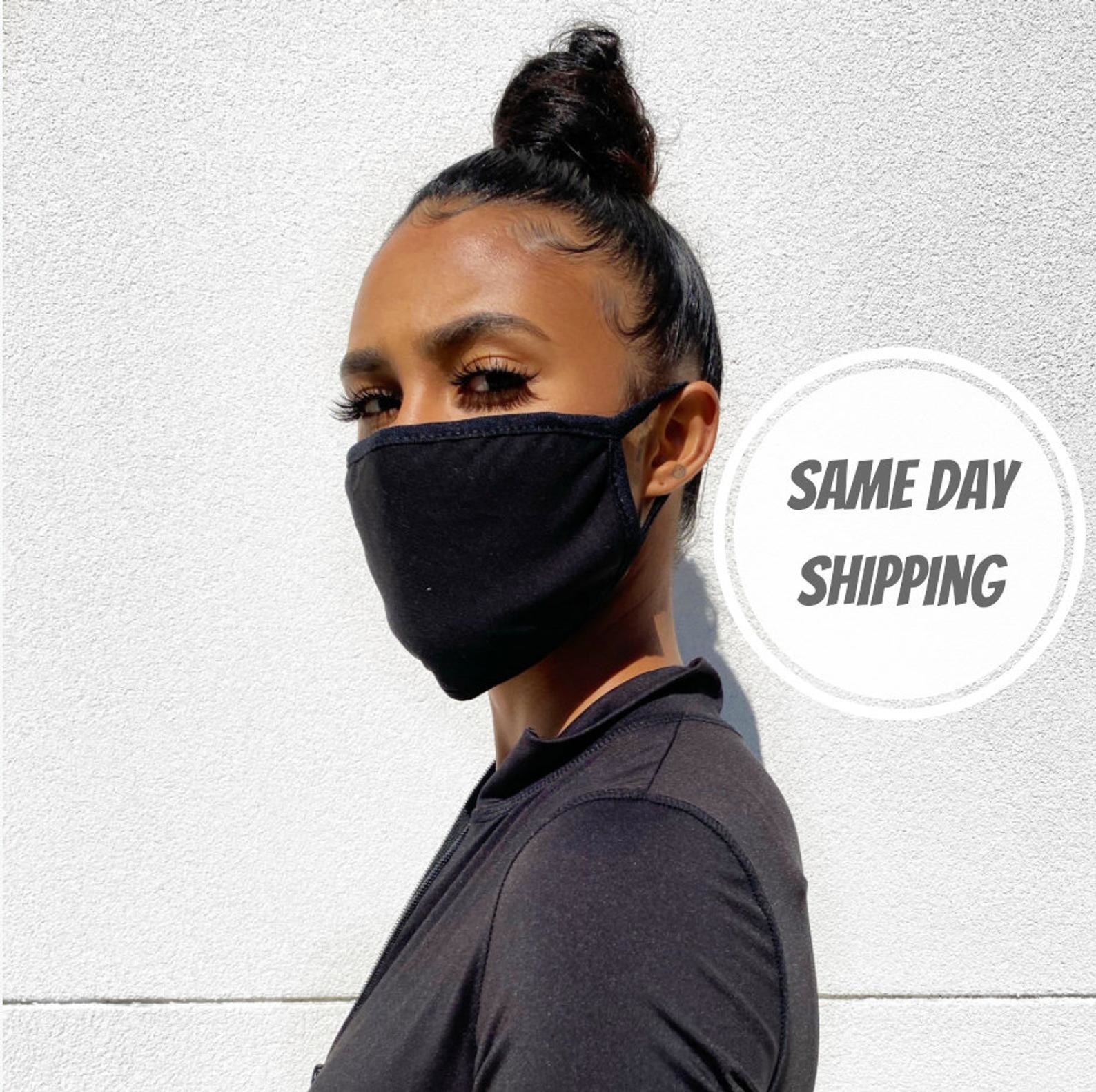 A model in a black face mask 