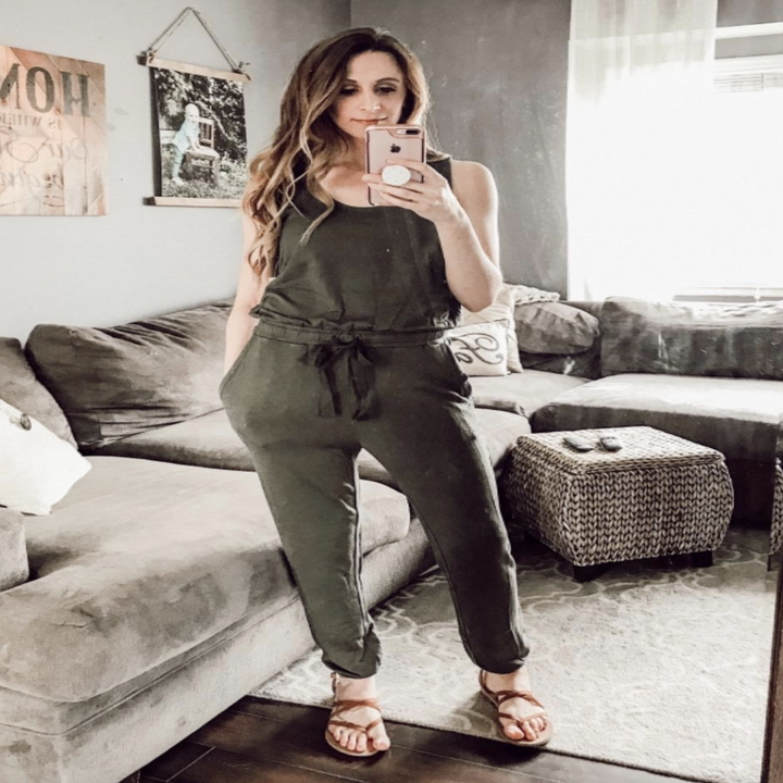 reviewer wearing the jumpsuit in olive green