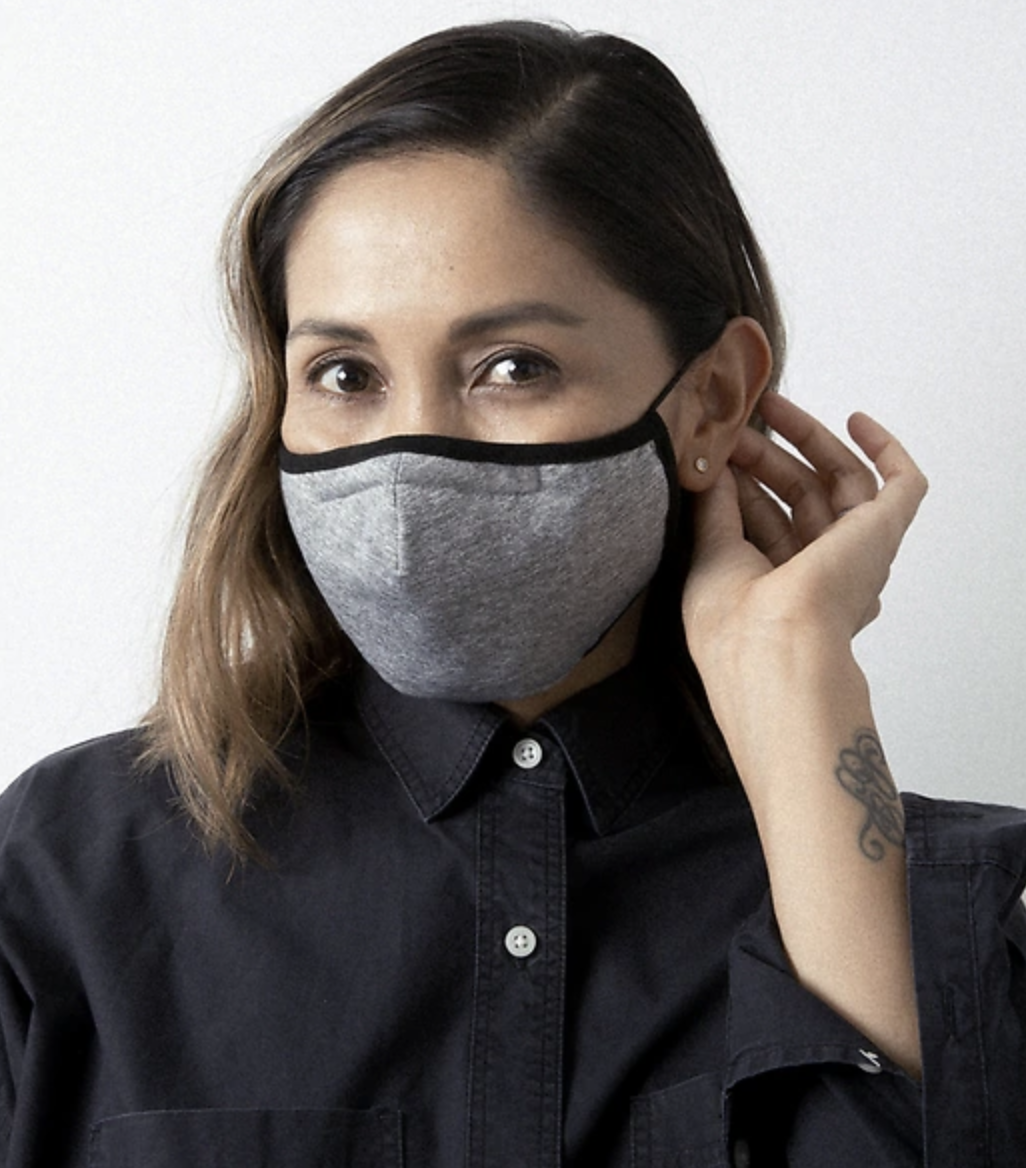 A model in a gray face mask 