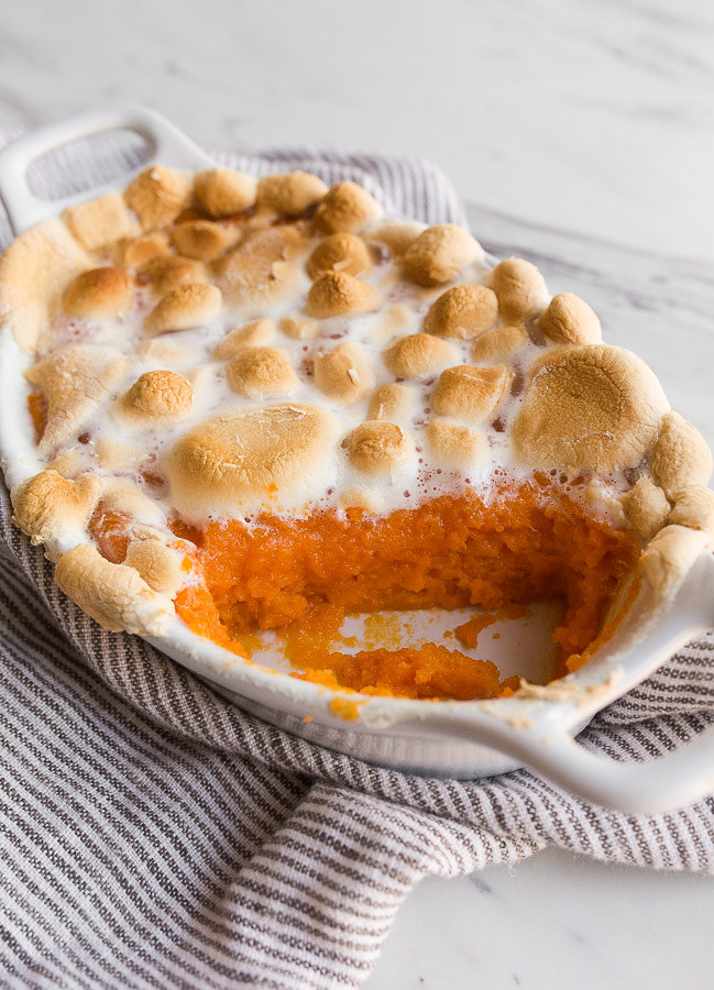 Bright orange sweet potato mash covered with roasted marshmallows