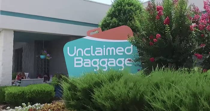 "unclaimed baggage" shop sign shaped like a suitcase