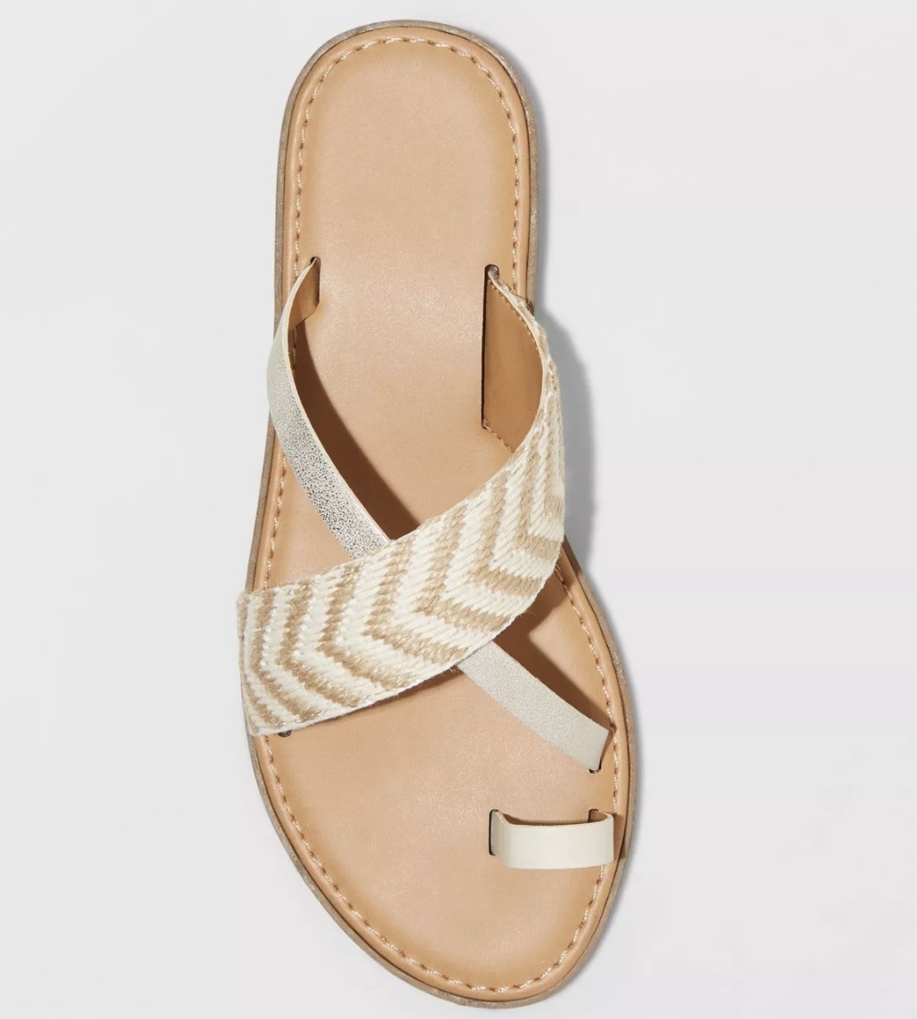 The brown sandal with criss-cross straw and silver straps 