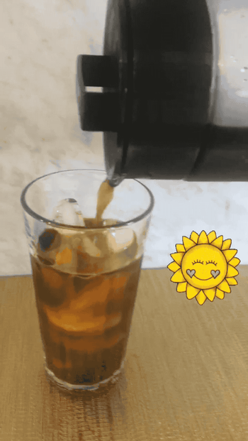 gif of cold brew coffee being poured into a glass with ice 