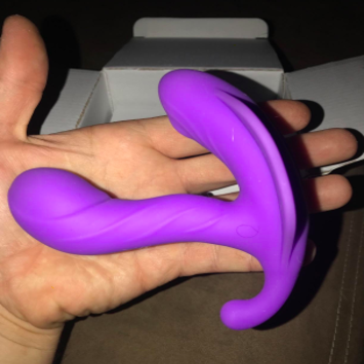 reviewer holding the vibrator in hand, showing it's about the size of open palm