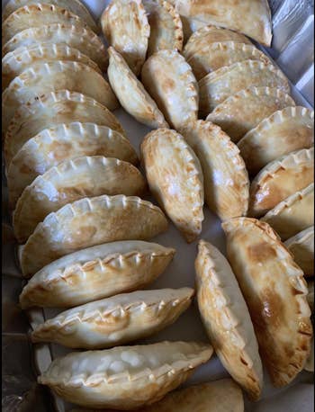 Reviewer photo of dozens of finished empanadas