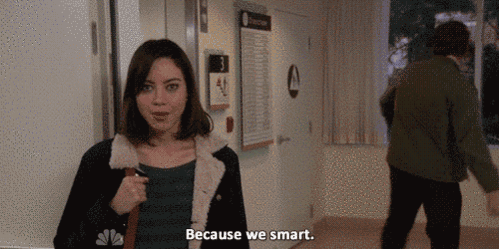 Gif of April from Parks and Rec saying &quot;Because we smart&quot; while Andy runs into a wall