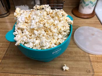 The same popper, but now overflowing with popped popcorn